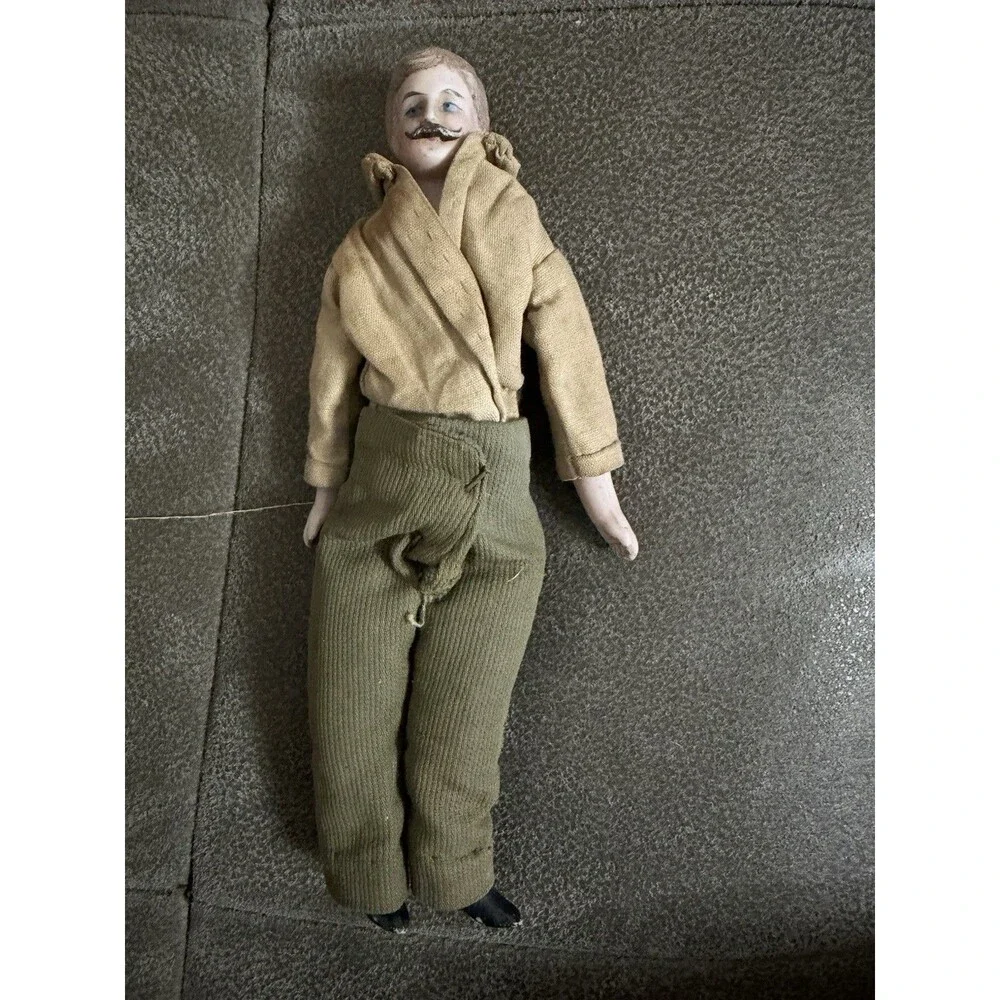 Antique German bisque gentleman doll, approximately 7 inches tall,